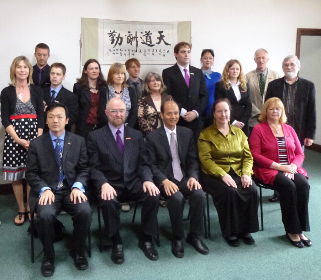 A group of graduates in chinese medicine photographed with the Chinese Ambassador to Ireland in the College in Dublin