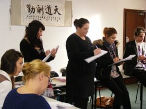 Studious trainees taking notes of the demonstration given by the teacher